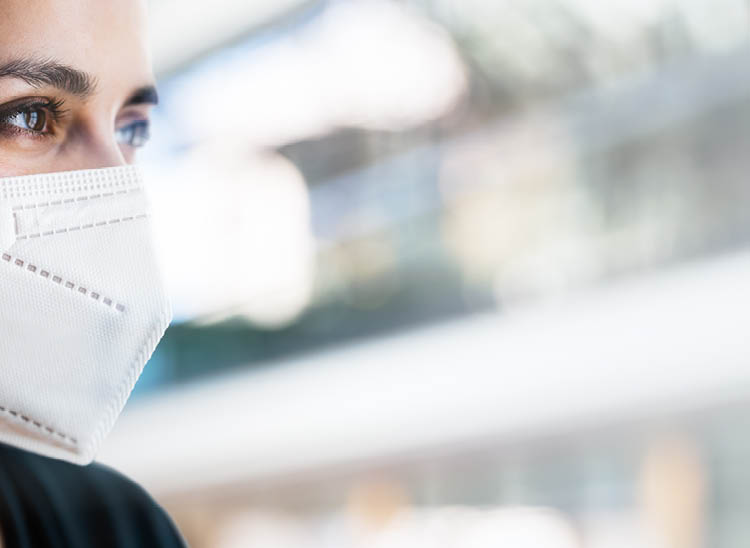 Closeup Up Of Woman Wearing N95 Medical Face Mask