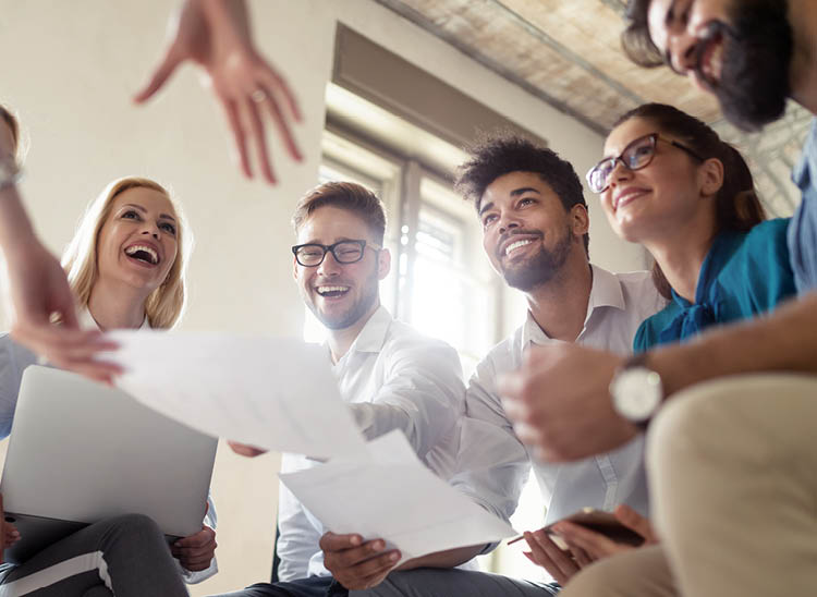 Successful happy group of students learning software engineering and business during presentation